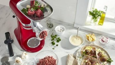 KitchenAid KSMFGA grinder attachment with ground meat ready for cooking.