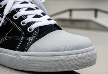 Close-up of reinforced skate shoe showing toe cap protection and durable construction