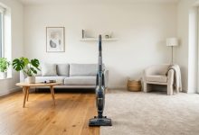 Side-by-side comparison of a budget corded Hoover upright vacuum and a premium cordless stick vacuum.