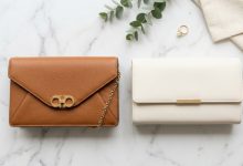 Modern affordable clutch bag on a table next to a champagne glass.
