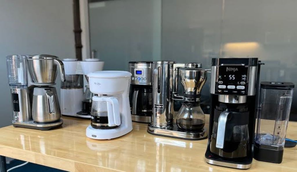 Close-up of coffee pouring from a coffee maker into a glass carafe