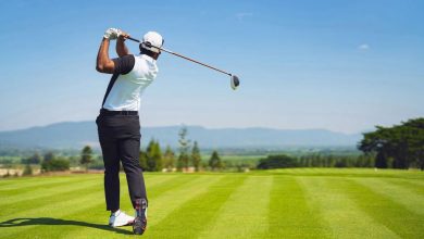 Golfer practicing accuracy with simple golf training aids on range