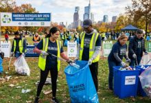 Volunteers collecting recyclables during America Recycles Day 2026 community cleanup