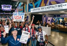 Fans celebrating inside an LA28 Olympics venue with ticket and hospitality information