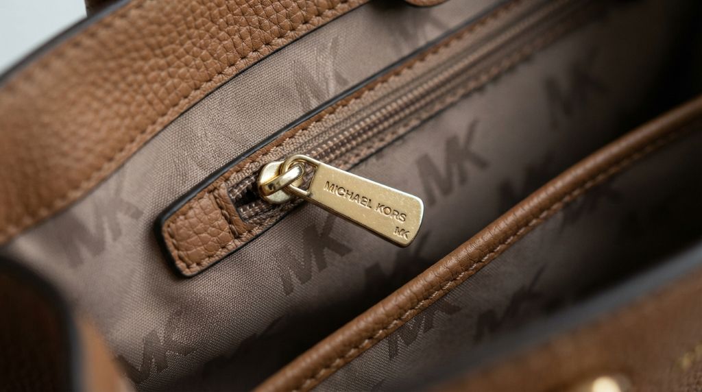 Inspecting Michael Kors tags and stitching for genuine details
