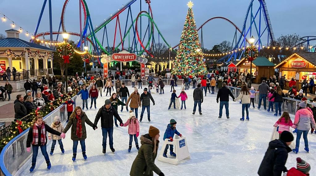 Families ice skating at Carowinds WinterFest winter celebration